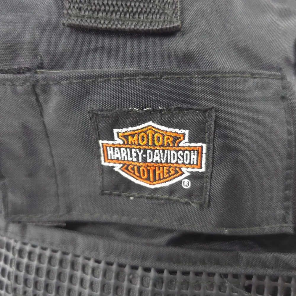 VINTAGE HARLEY DAVIDSON AN AMERICAN LEGEND BLACK DUFFLE BAG WITH SHOULDER STRAP.